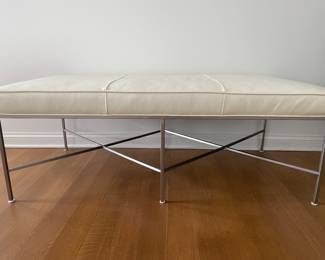 Designer leather bench with brushed metal base. Dimensions: Width 58" x depth 30" x height 21". Retail price was $3,675. 