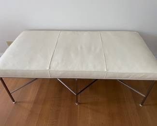 Designer leather bench with brushed metal base. Dimensions: Width 58" x depth 30" x height 21". Retail price was $3,675. 