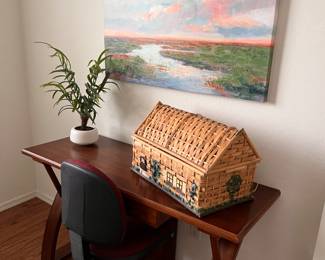 Wood desk with drawer and office chair
Wicker basket of house picture
Picture of sunset 