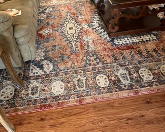 Spanish design carved coffee table
Large area rug multicolored