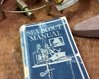 Antique and modern books, coffee table books and magazines. "The Sea Scout Manual"