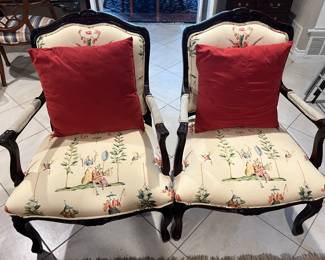Beautiful pair of bergere style chairs. These have been reupholstered and matching extra material is available. 
