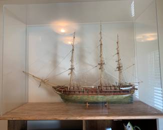 Huge wooden moden of ship U. S. Constitution in massive plexi-glass ddisplay case built by Mr. Fisher