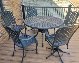 Patio table has 4 matching chairs + 1 rocker