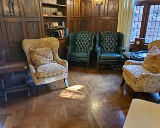 (2) Newer upholstered Wind back chairs (2) Leather tufted Queen Anne chairs