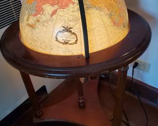 Wonderful lit globe on a wheeled wood base