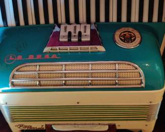 A stunning teal/cream accordion by Lo Duca Bros, Milwaukee, WI in its case
