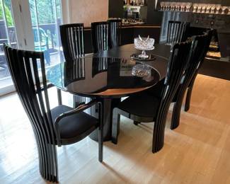 Tonon Ebony laquer dining set.  Table features two removable leaves.  Shown with 1.