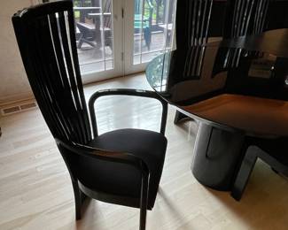 Tonon Ebony laquer dining set.  Table features two removable leaves.  Shown with 1.