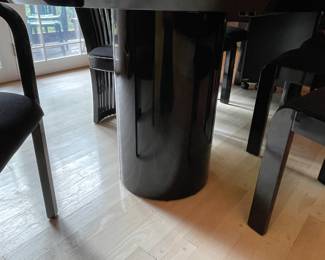 Tonon Ebony laquer dining set.  Table features two removable leaves.  Shown with 1.