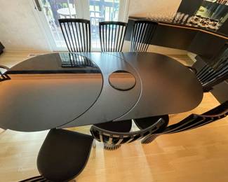 Tonon Ebony laquer dining set.  Table features two removable leaves.  Shown with 1.