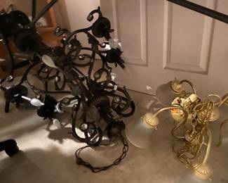 Brown Kathy Ireland chandelier it’s more beautiful than you can see it on this picture.  A gold chandelier next to it it’s a beautiful piece ready for its new home!