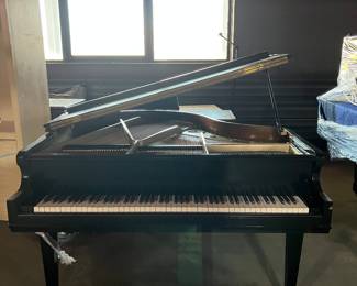 FRONT VIEW OF BABY GRAND PIANO
