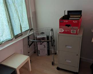 Rolling file cabinet, walker with basket and tray, small plastic tables. 