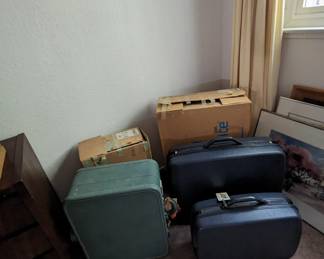 Another view of luggage with original boxes for the Samsonite pieces. 