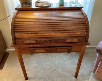 ANTIQUE ROLL TOP DESK. IT IS A SMALLER SIZE.  