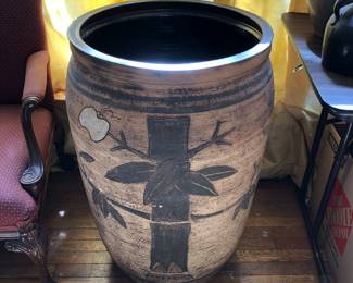 Large Chinese ceramic pot is broken in two places and must be repaired