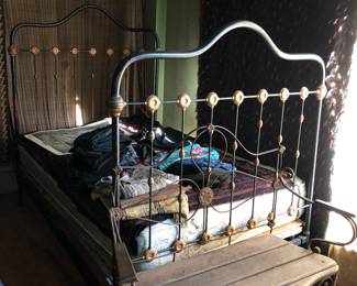 Iron bed and 1 of 3 of the same iron and wood benches
