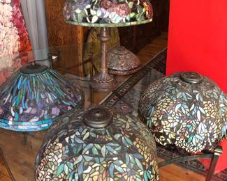 Reproduction leaded glass Tiffany style shades, the 2 upfront & smallest being without damage and the other 2 with very small damage