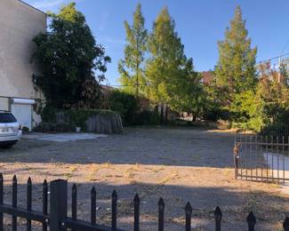 Parking lot adjacent to building you will enter from the door to right of vehicle