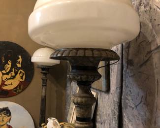 Pair of large metal floor lamps with religious motif on base, used either in a church or Funeral home