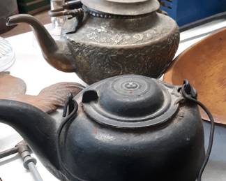 Cast iron and copper kettles