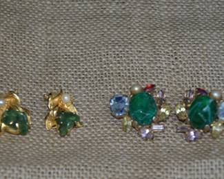 https://www.auctionninja.com/come-find-your-treasure/product/118-alice-caviness-clip-earrings-green-gem-center-stone-multi-color-gold-tone-green-gem-pearl-clip-earring-400084.html