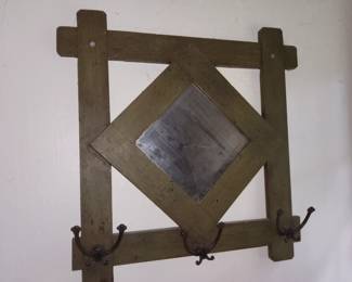 Wall mirror with hooks