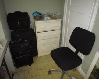 Luggage and antique dresser