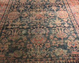 Large worn antique Persian carpet, signed