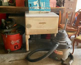 Metal storage. Shop vacs.  Microscope set.