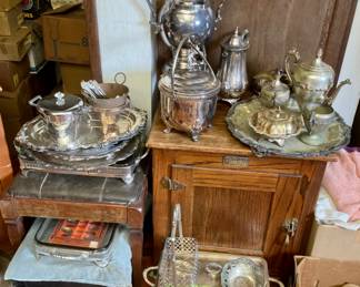 More silver plate items.  Wood cabinet.
