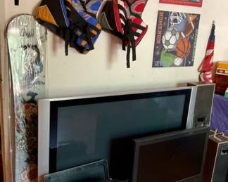 TVs, monitor, life jackets, snowboard, speakers.