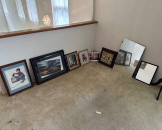 Variety of framed art and mirrors