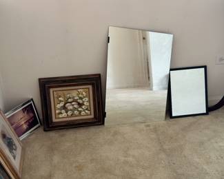 Variety of framed art and mirrors