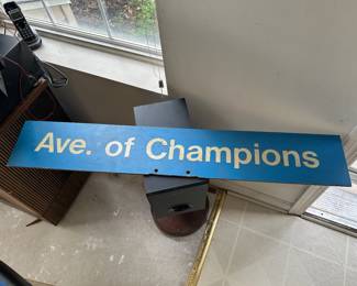 Ave. of Champions metal sign