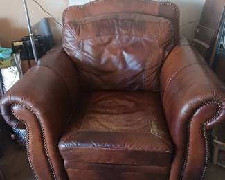 Leather chair and ot has an ottoman