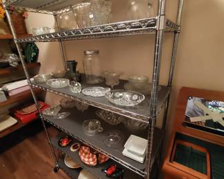 Dishes, platters; the metal shelving unit is for sale, too!