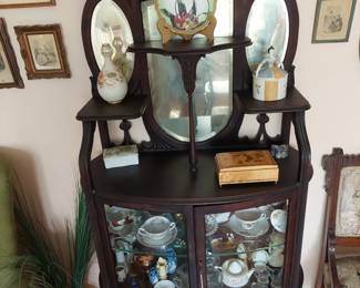 antique, multi-level buffet with beveled-glass mirrors