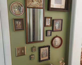 entryway mirror and vintage framed artwork