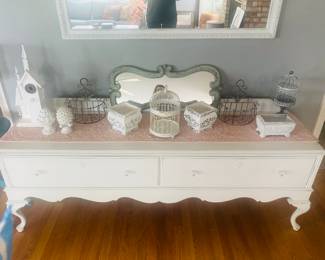 Miscellaneous decor on top of a vintage low dresser. Dresser is a must see $125