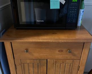 New microwave on solid wood stand 