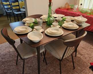 Eggshell dishes and MCM Cromkraft table with six chairs