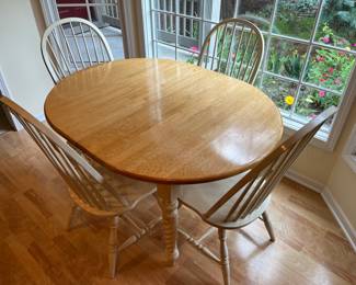 Dining table with four chairs and one leaf (leaf shown in following photo).