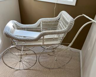 Vintage wicker baby carriage/buggy.