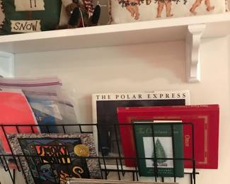 Great Holiday Pillows.  Notice the Bookrack on the wall.