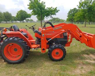Kubota L3400 with loader, 5' cutter, and 5' box blade.  Only 188+ hours. 