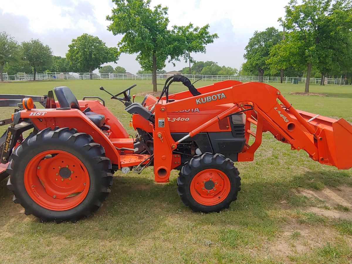 Kubota L3400 with loader, 5' cutter, and 5' box blade.  Only 188+ hours. 