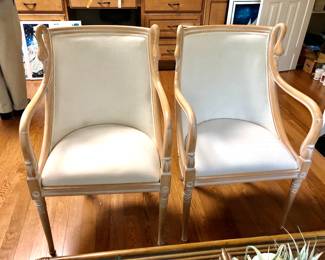 Light wood arm chairs with swan head detail
