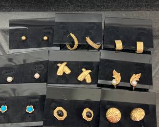An assortment of 14K gold earrings.